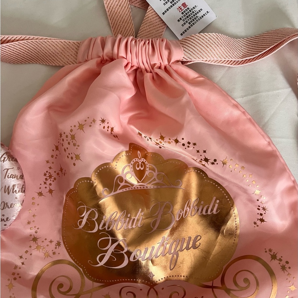 Disney Pink and Gold Bibbidi Bobbidi Bag drawstring and Boutique Hair Accessory.